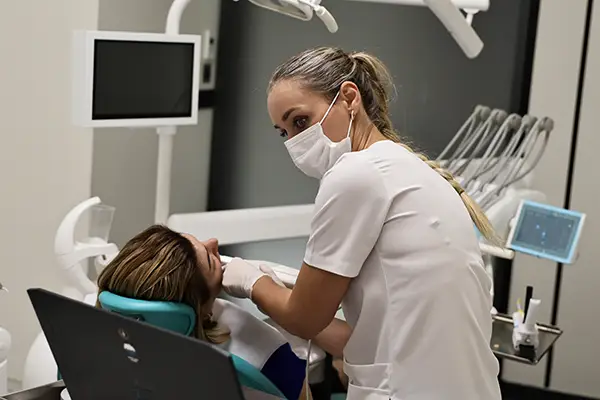 Prof Clinic dental professional treating a patient